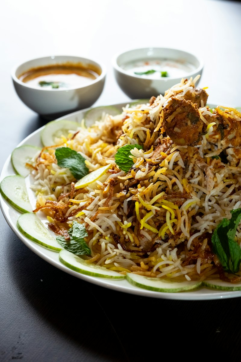 Fragrant biryani garnished with mint on a ceramic plate